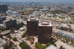 Drone shot capturing modern buildings in a bustling cityscape, perfect for urban visuals.
